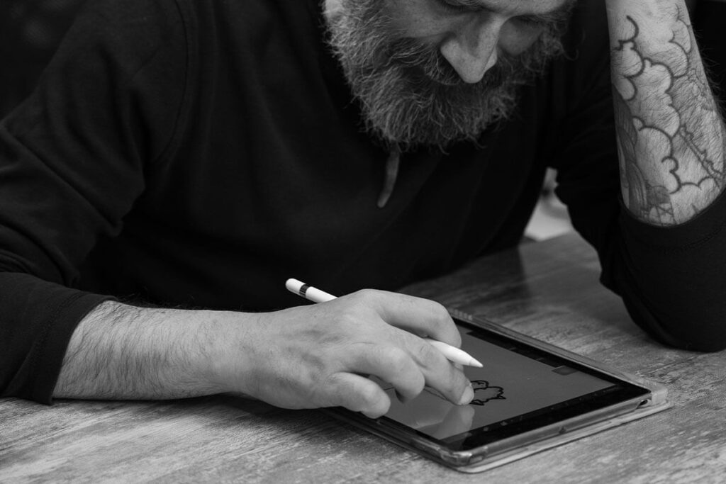 Tattoo artist designing a custom tattoo